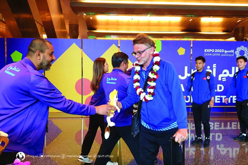 Vietnam’s coach Philippe Troussier is greeted on his arrival in Doha on Friday.