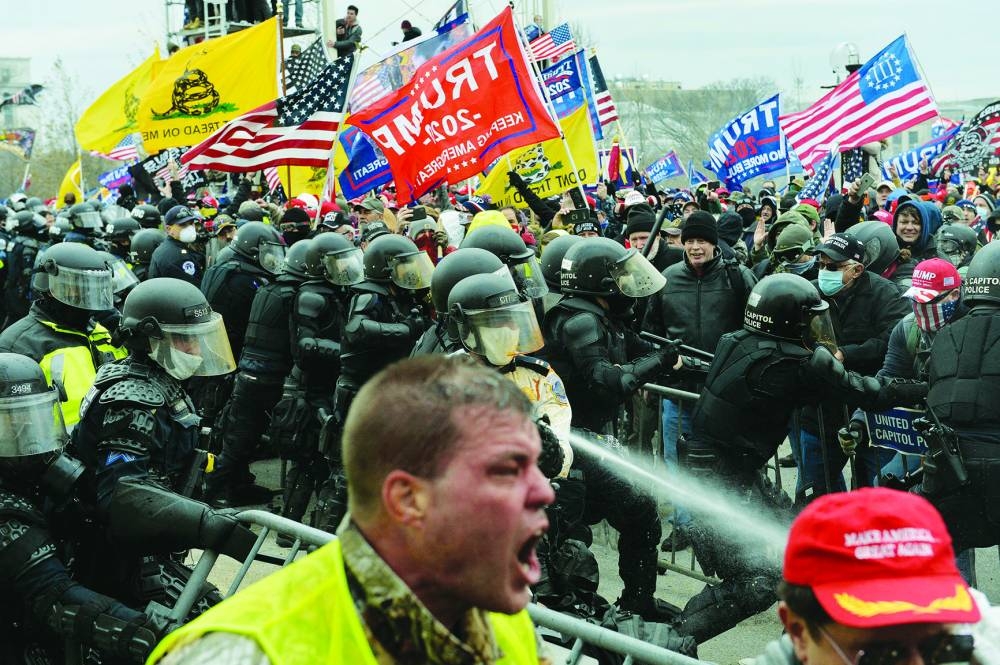 
Trump supporters clash with police and security forces as they try to storm the US Capitol in Washington, DC on January 6, 2021. 