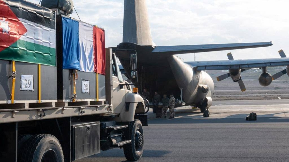Humanitarian and medical aid boxes are loaded into a plane to be airdropped by the French and Jordanian air forces for a field hospital set up in Gaza's second city, Khan Younis, according to a French presidency official, at Zarqa airport, Jordan. Jordan Armed Forces/Handout via REUTERS