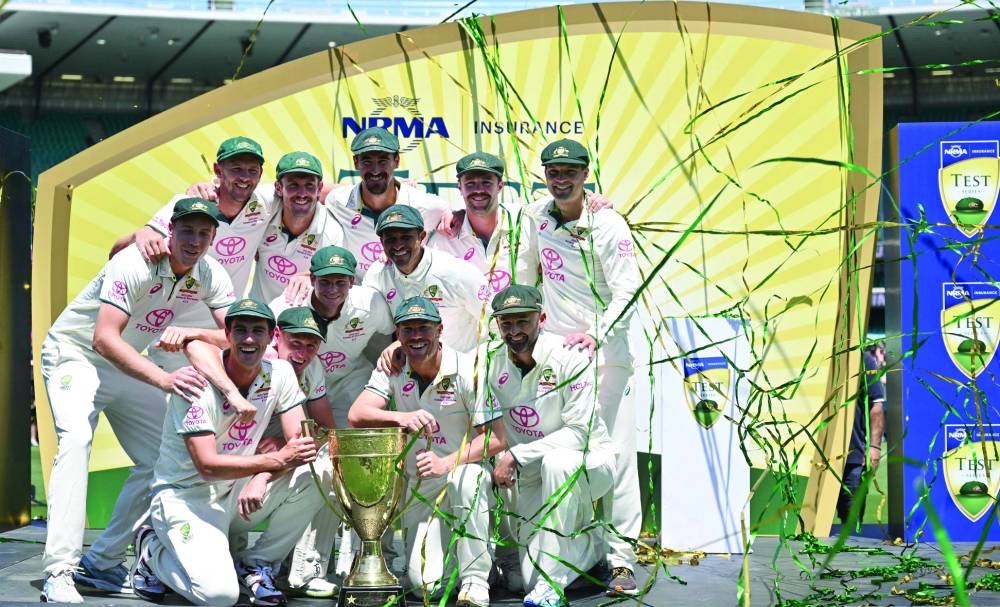 Australia players celebrate their victory after defeating Pakistan in the final Test of the three match series at the SCG in Sydney on Saturday. (AFP)