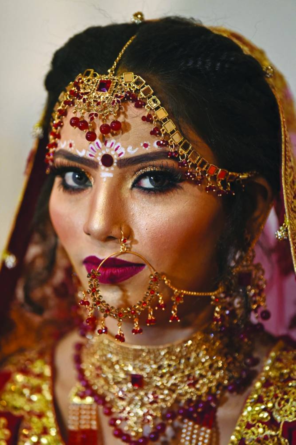 From left: Pakistani Hindu bride Kalpana Devi poses while waiting to participate in a mass marriage ceremony organised by the Pakistan Hindu Council, a non-profit organisation, in Karachi. (AFP)