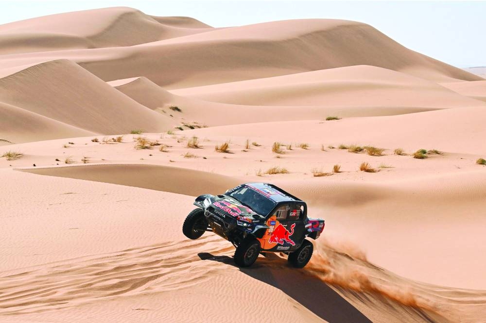 Toyota Gazoo Racing’s Brazilian driver Lucas Moraes and Spanish co-driver Armand Monleon compete during Stage 3 of the Dakar Rally 2024, between Al Duwadimi and Al Salamiya, Saudi Arabia, on Monday.  (Reuters)