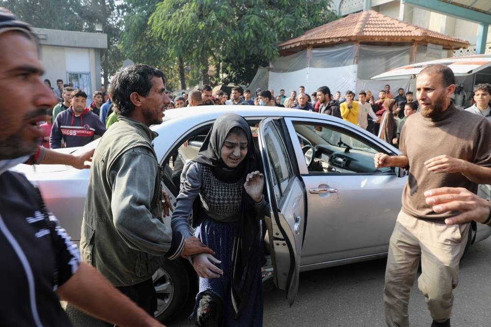 A Palestinian woman wounded in an Israeli strike arrives at the European Hospital, in Khan Younis in the southern Gaza Strip, on Tuesday. REUTERS