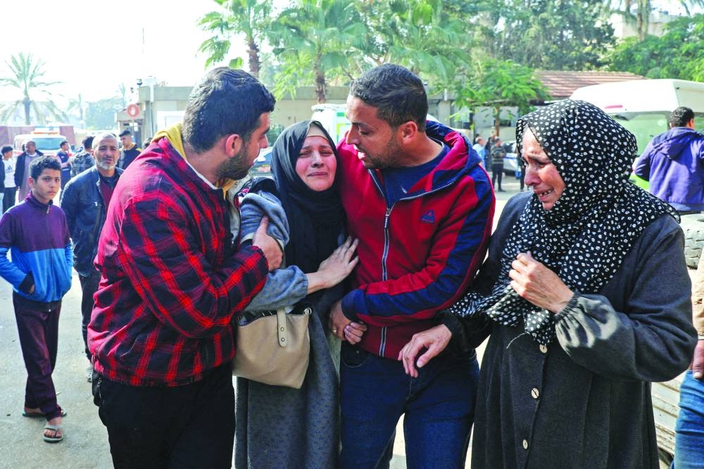 
Palestinian women react following an Israeli strike, at the European Hospital, in Khan Yunis in the southern Gaza Strip, yesterday. 
