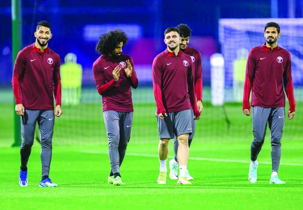 Qatar defender Bassam al-Rawi (third right) with teammates during a training session in Doha on Tuesday. PICTURES: Noushad Thekkayil