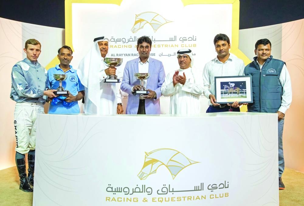 Connections of X Force celebrate after winning the Ras Laffan Cup on Wednesday. PICTURES: Juhaim