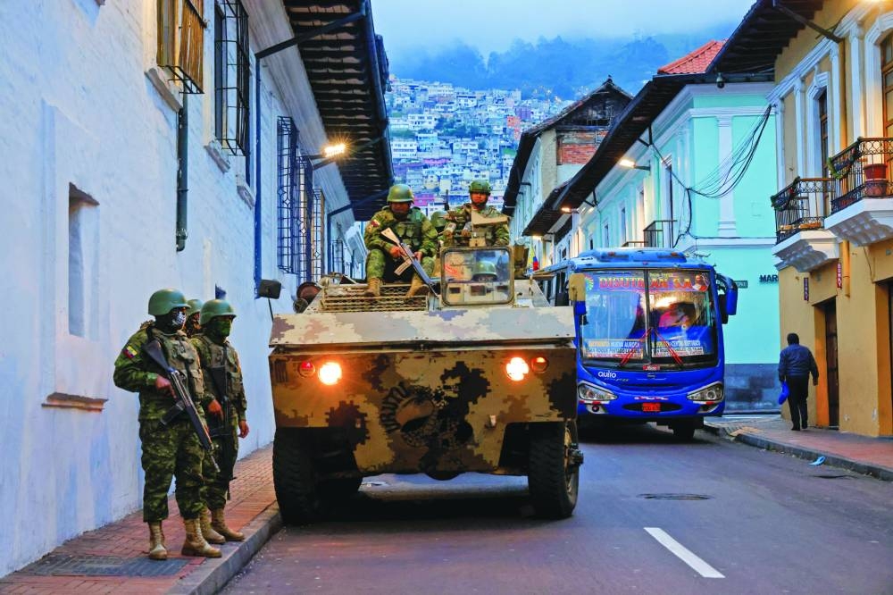 
Soldiers in an armoured vehicle patrol the city’s historic centre following an outbreak of violence. (Reuters) 