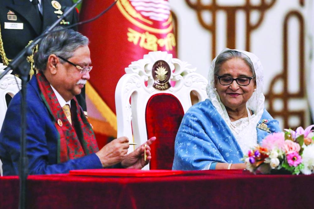 
Bangladeshi President Mohamed Shahabuddin administers oath to Sheikh Hasina as the country’s prime minister in Dhaka. 