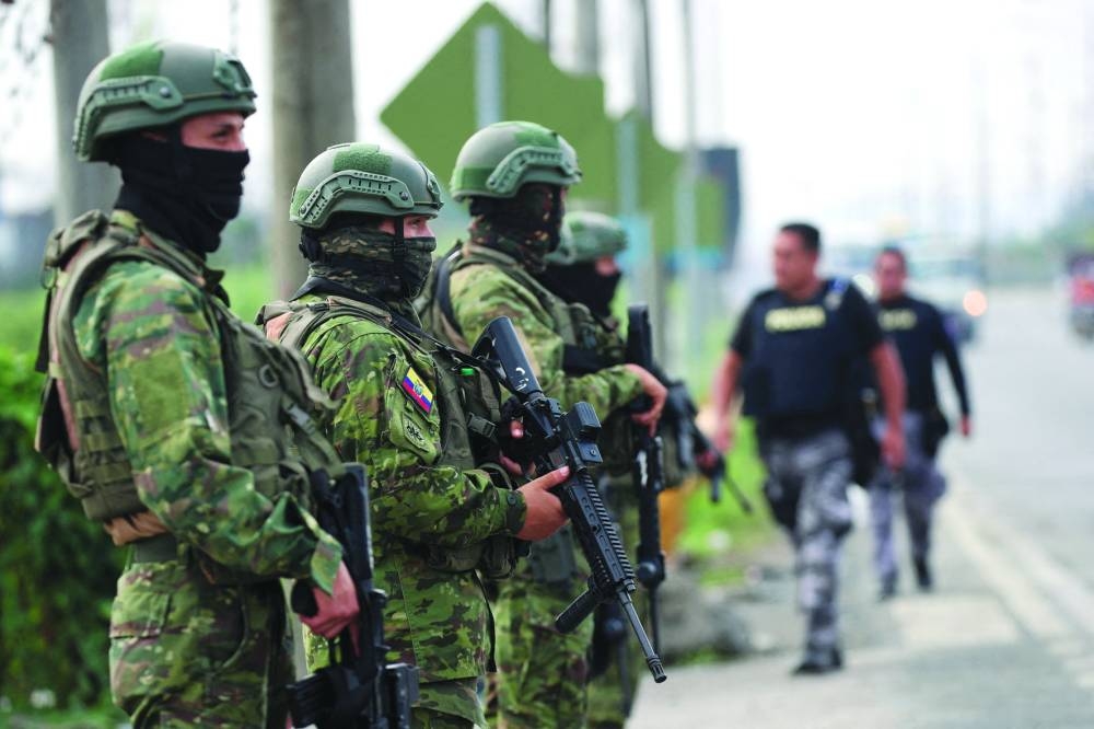 Soldiers keep watch outside the Zonal 8 prison after Ecuador's President Daniel Noboa declared a 60-day state of emergency.