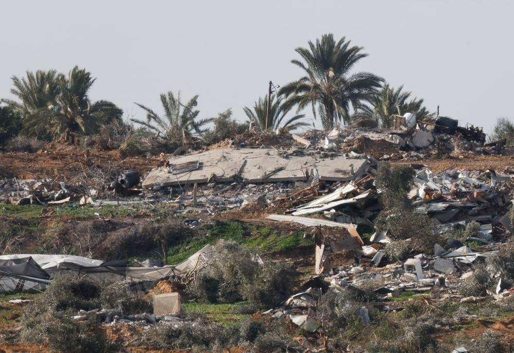 Destroyed buildings lie in ruin in Central Gaza near the Israel-Gaza border, as seen from Israel, on Saturday. REUTERS