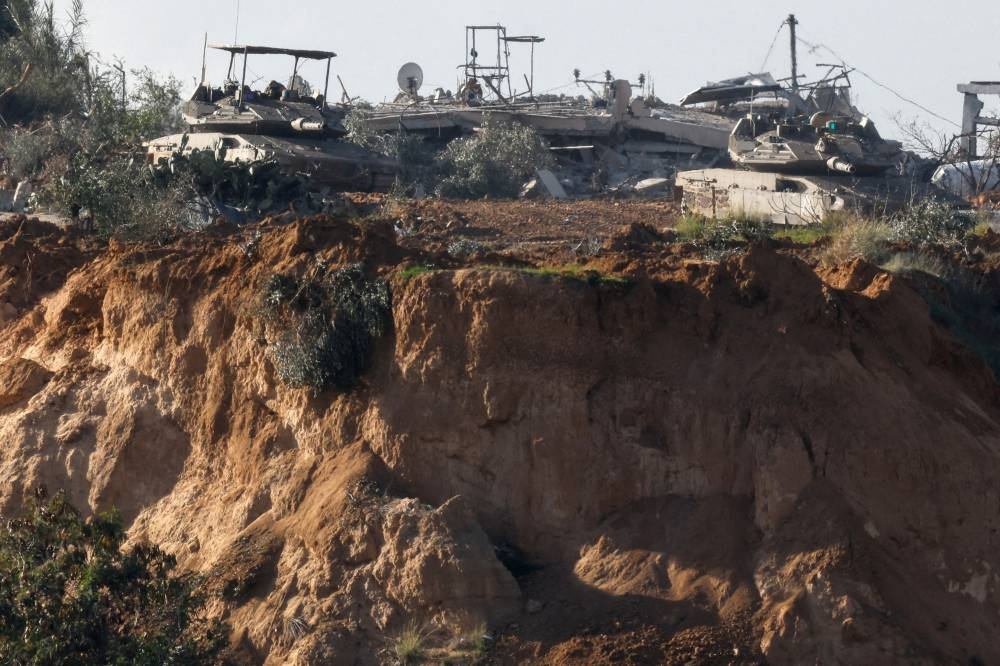 Tanks manoeuvre in central Gaza, amid the ongoing conflict between Israel and the Palestinian Islamist group Hamas, near the Israel-Gaza border, as seen from Israel, on Saturday. REUTERS
