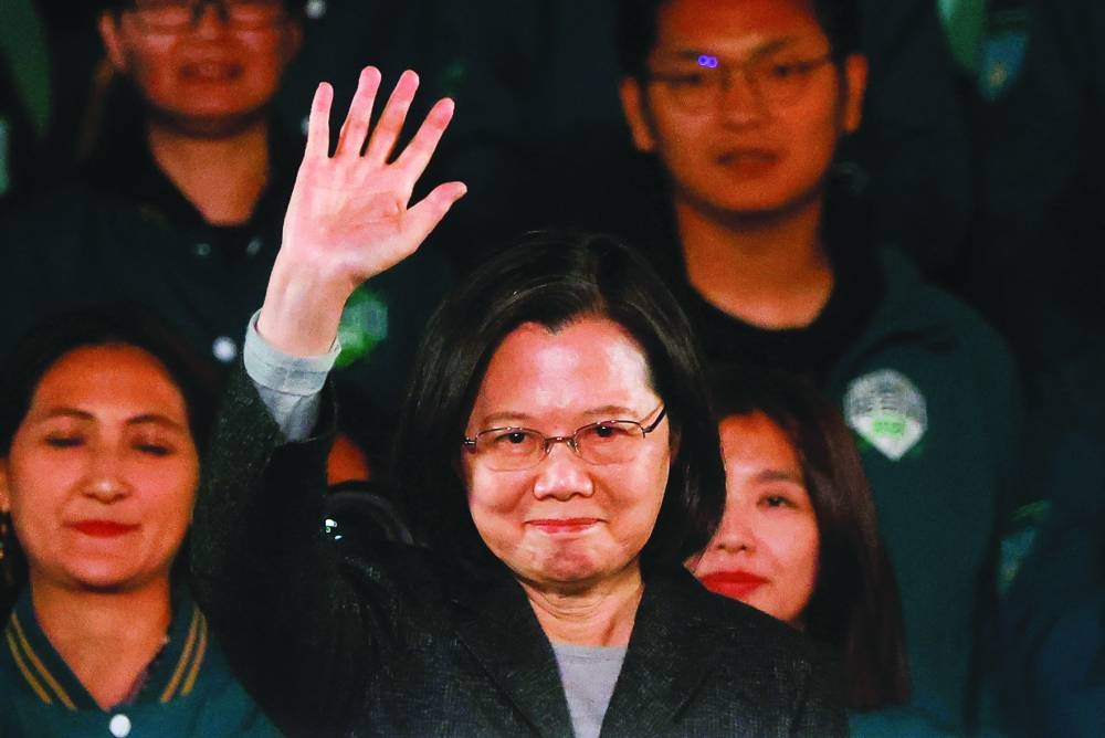 
Taiwan’s outgoing president Tsai Ing-wen waves during a rally in Taipei. 