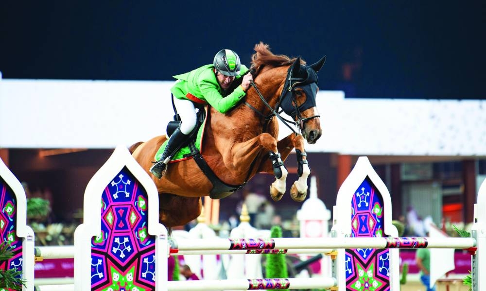 
Austria’s Gerfried Puck clears a hurdle with his 11-year-old stallion Equitron Naxcel V during the opening round of the Doha International Equestrian Tour Championship at Al Shaqab’s Longines Outdoor Arena. 