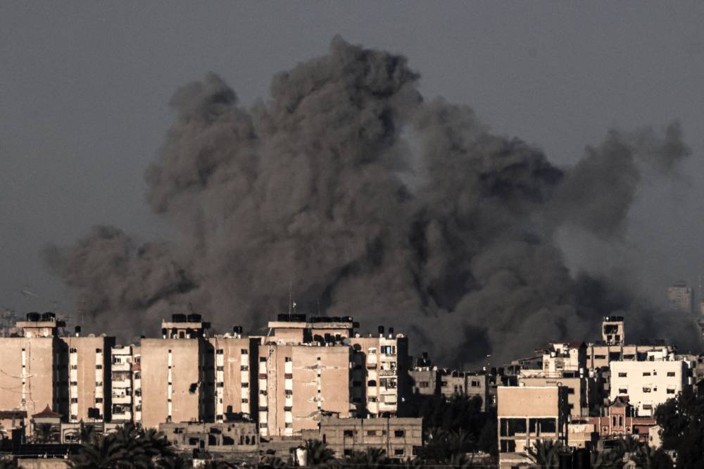 Smoke billowing over Khan Yunis in the southern Gaza Strip during Israeli bombardment. AFP