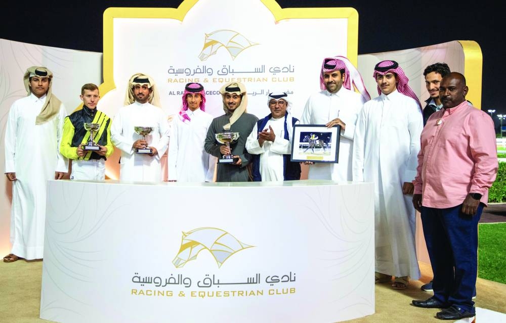 
The connections of Posuelo Py celebrate with the trophy after the six-year-old bay gelding won the Al Kharrara Cup. PICTURES: Juhaim 