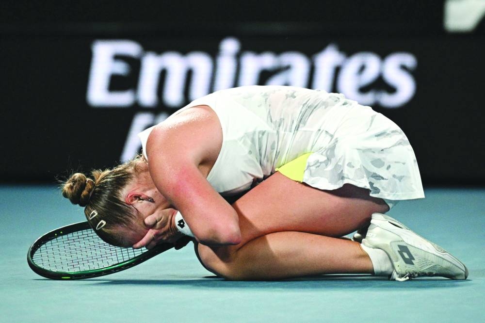 Russia’s Anna Blinkova celebrates after victory against Kazakhstan’s Elena Rybakina in their singles match on day five of the Australian Open in Melbourne on Thursday. (AFP)