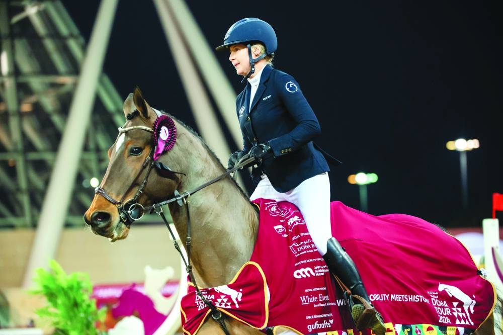 Sweden’s Evelina Tovek celebrates with bay gelding Moeboetoe V/D Roshoeve after winning the CSI4* 1.50m class during the second leg of the Doha International Tour on Thursday.