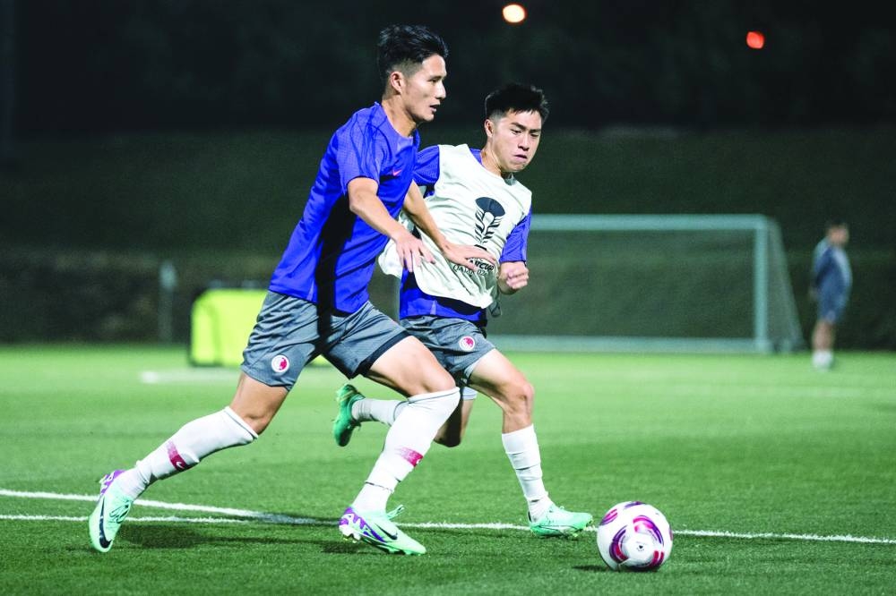 Hong Kong players at a training session in Doha on Thursday.