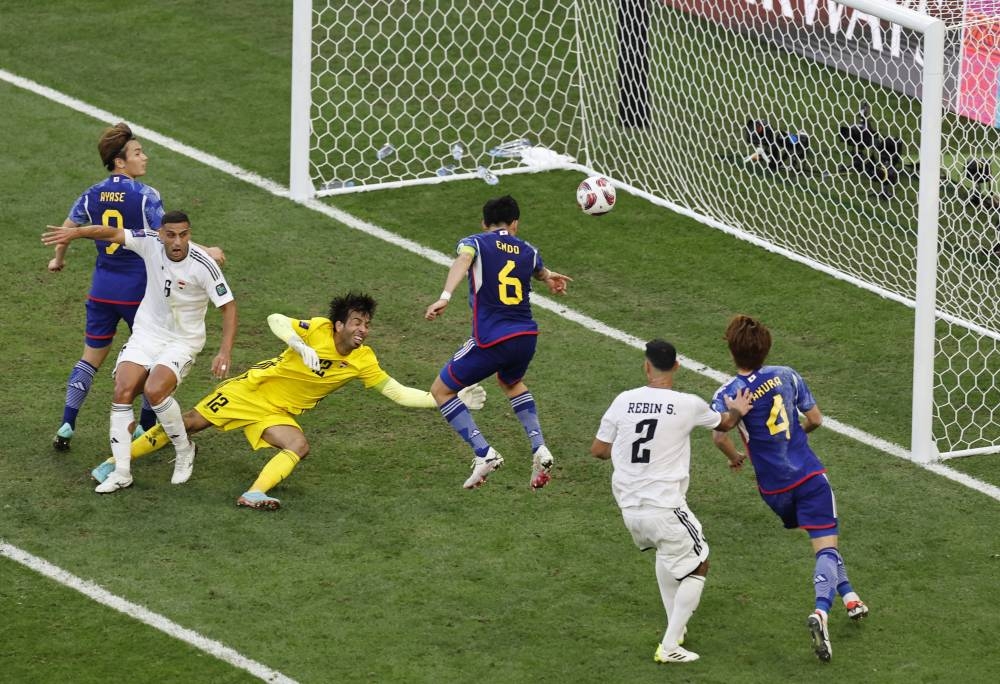 Japan's Wataru Endo scores their first goal. REUTERS