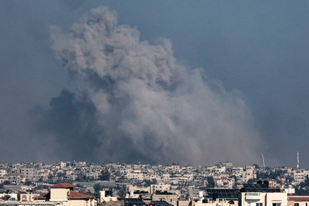 A picture taken from Rafah shows smoke billowing over Khan Yunis in the southern Gaza Strip during Israeli bombardment on Saturday. AFP