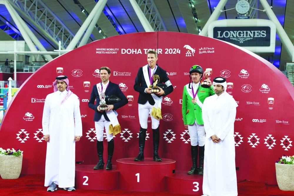Hamad bin Abdulrahman al-Attiyah, President of the Asian Equestrian Federation, and Sheikh Ahmad bin Nooh al-Thani, Secretary-General Qatar Equestrian Federation and Chairman Organising Committee Doha Tour, with podium winners of CSI4* Grand 
Prix-Jump Off (1.55m) of Doha International Tour at Al Shaqab on Saturday.