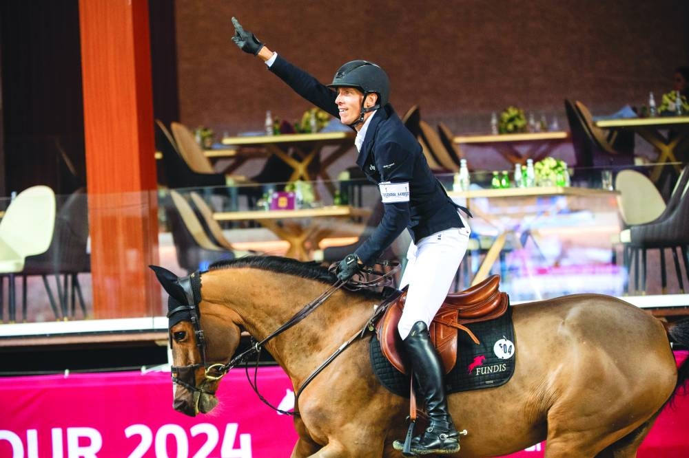 
Henrik Von Eckermann celebrates after riding bay mare Glamour Girl to victory. 