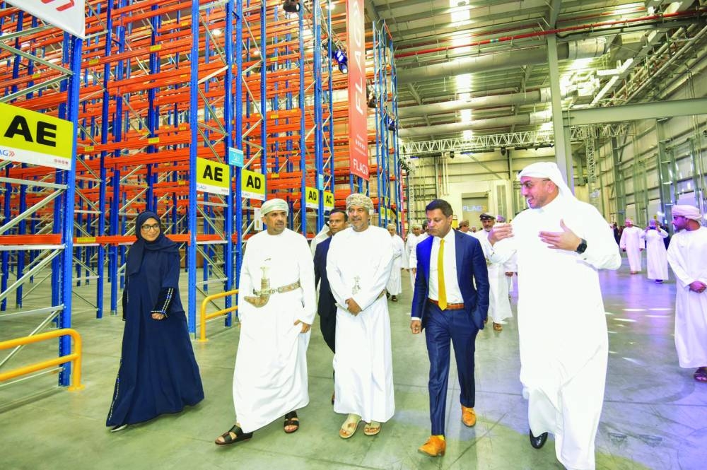 Dignitaries tour the FLAG's state-of-the-art logistics facility at Khazaen Economic City in Oman.