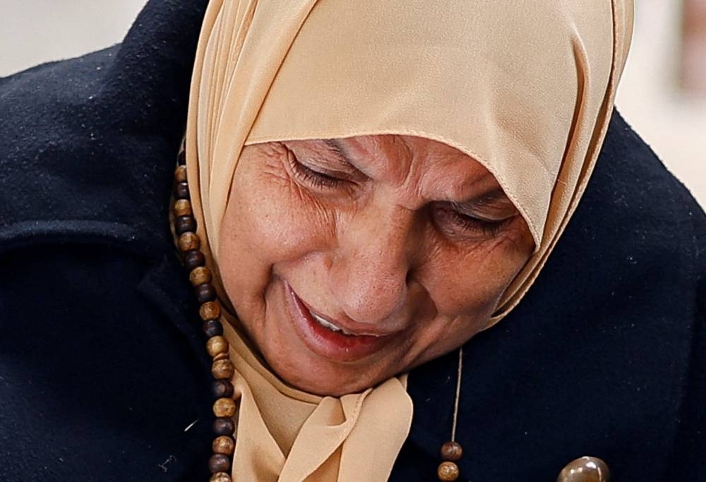 A mourner reacts next to the body of a relative, in Rafah in the southern Gaza Strip, Sunday. REUTERS