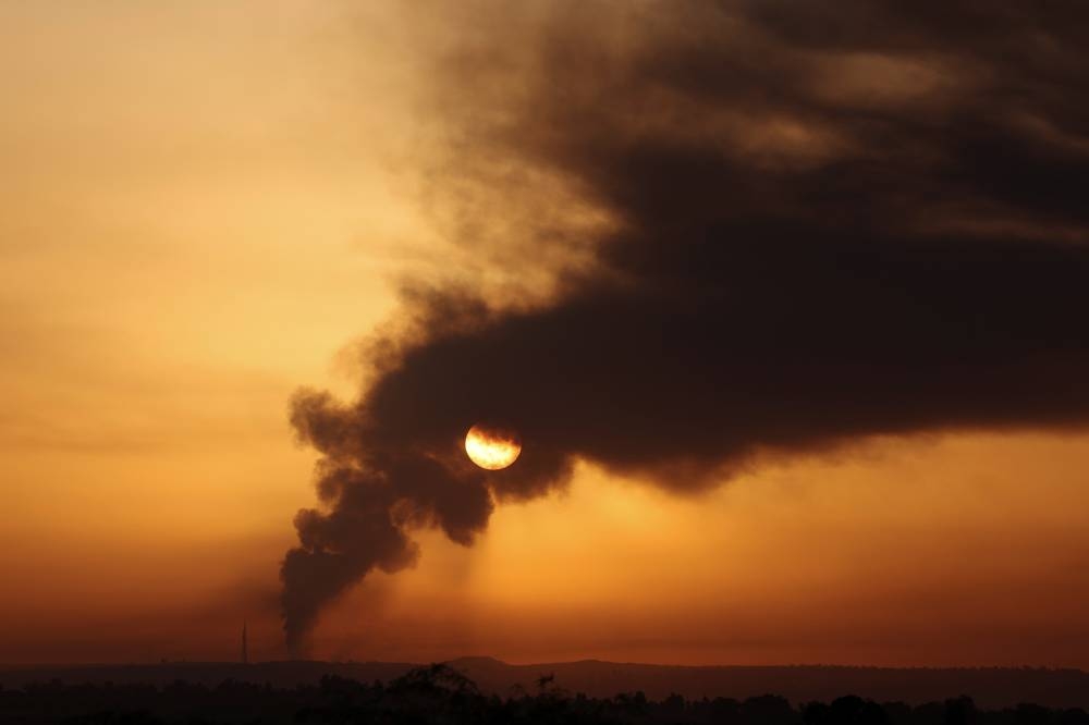Smoke rises over the Gaza Strip, as seen from Israel's border with Gaza in southern Israel, Sunday. REUTERS