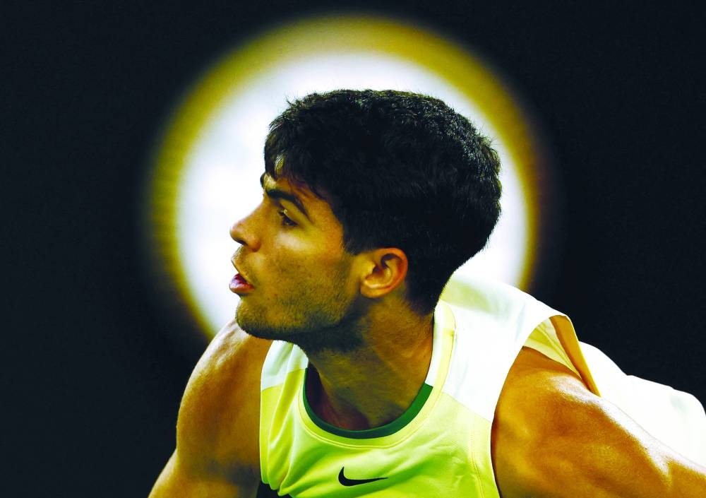Spain’s Carlos Alcaraz in action during his fourth-round match against Serbia’s Miomir Kecmanovic at Melbourne Park on Monday. (AFP)