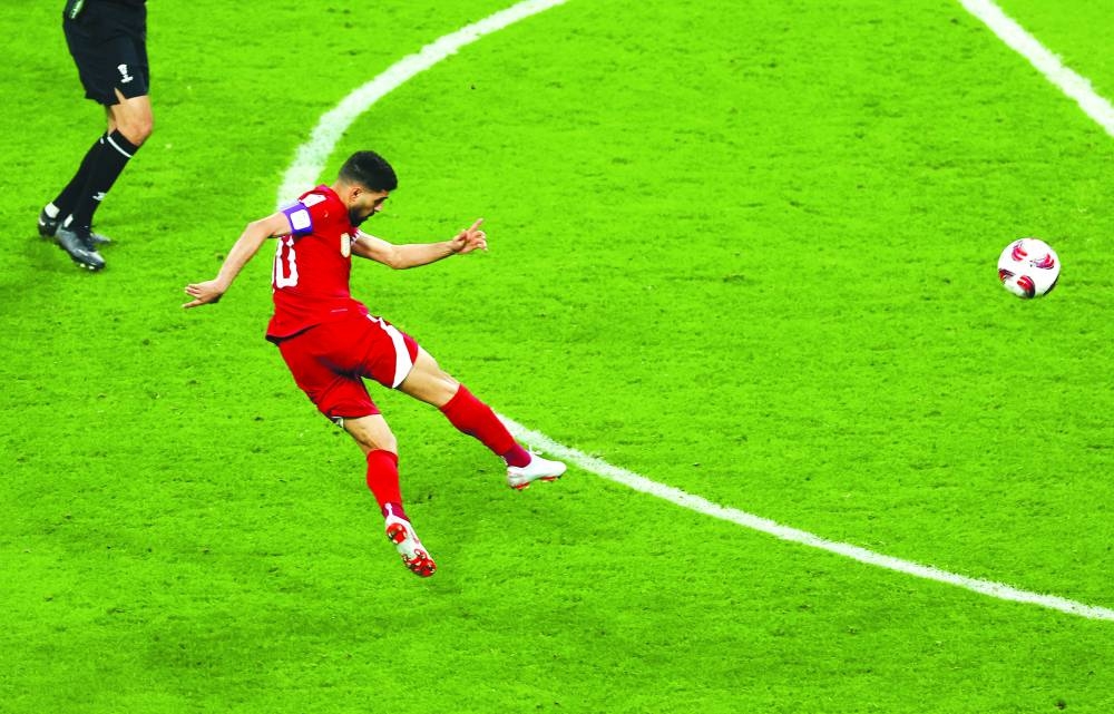 
Qatar’s Hassan al-Haydos scored a stunning long-range goal against China. 