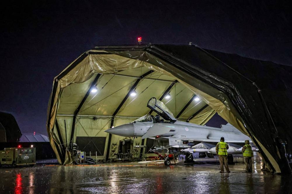 Royal Air Force Typhoon FGR4 being preparded to take off. Royal Air Force Typhoon aircraft have conducted precision strike operations against Houthi military targets in response to further attacks on shipping in the Red Sea, in this undated handout image. UK MOD/Handout via REUTERS