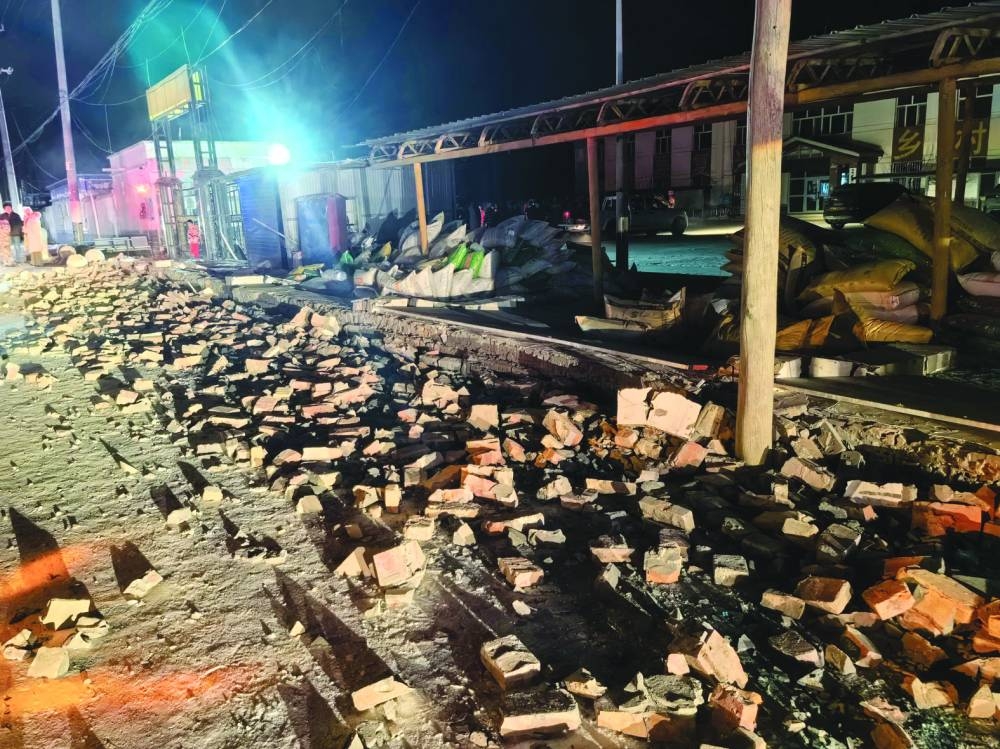 
The rubble of houses damaged by a magnitude 7.0 earthquake is seen on a street in Wushi County. 