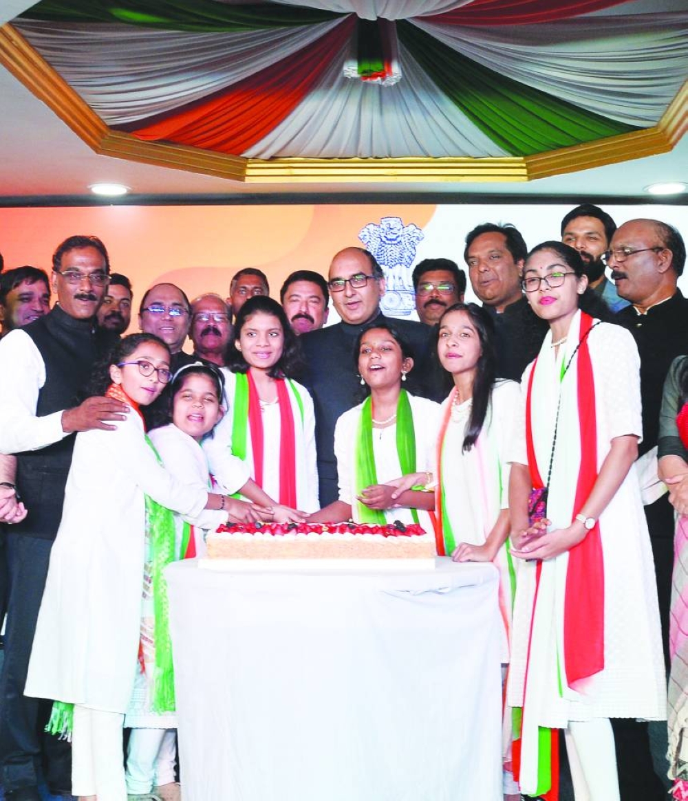 Ambassador Vipul cutting cake along with children and others to celebrate the occasion.