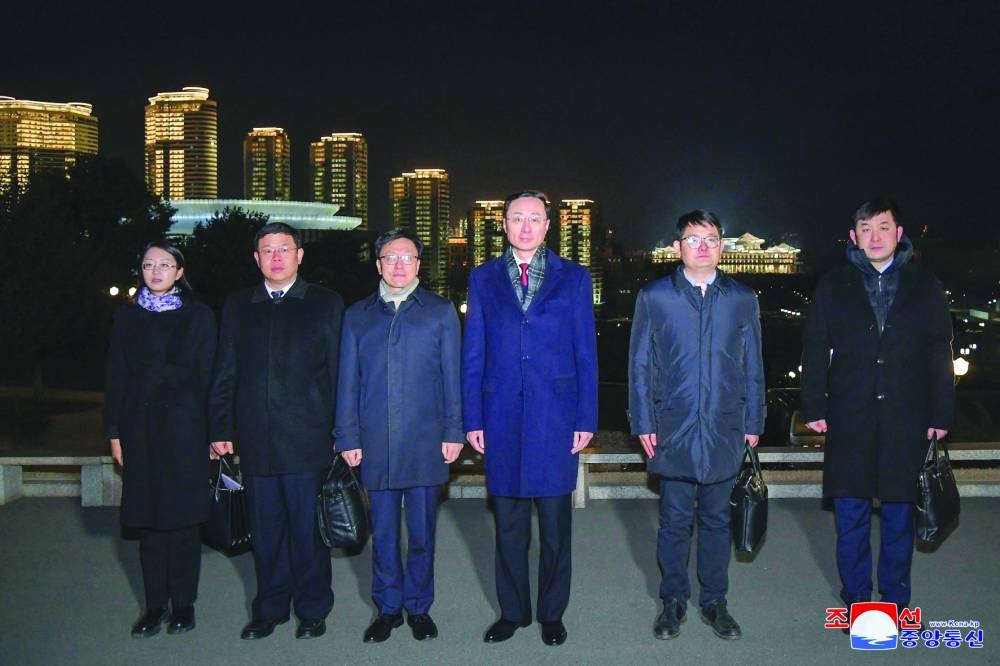
A Chinese delegation led by Vice Foreign Minister Sun Weidong poses for a photo during a visit to the country, in Pyongyang, North Korea. 