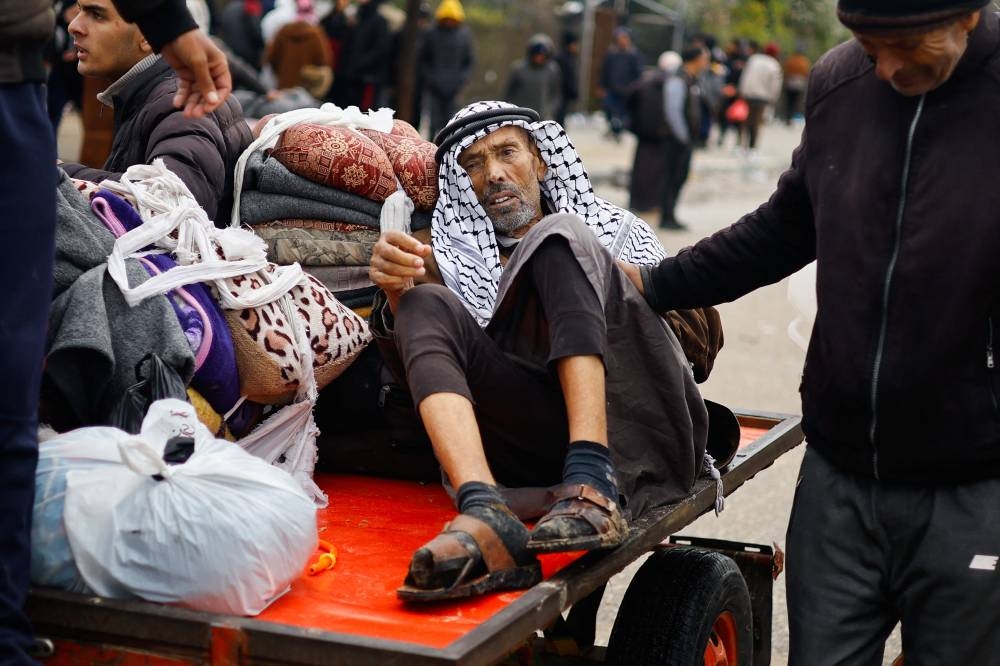 Palestinians fleeing Khan Younis, due to the Israeli ground operation, move towards Rafah in the southern Gaza Strip, on Saturday. REUTERS