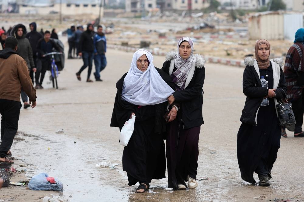 Palestinians fleeing Khan Younis, due to the Israeli ground operation, move towards Rafah in the southern Gaza Strip, on Saturday. REUTERS