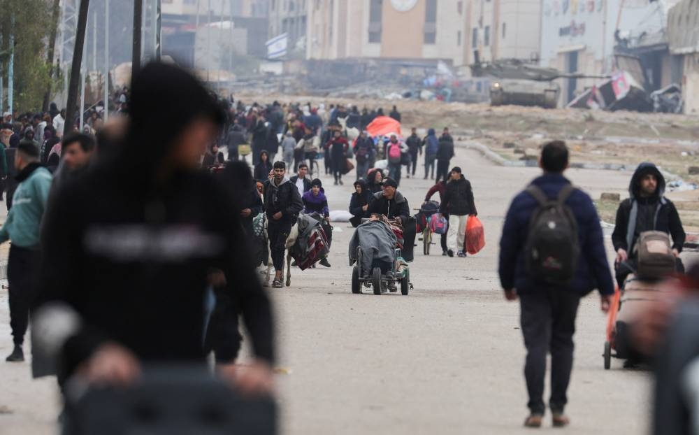 Palestinians fleeing Khan Younis, due to the Israeli ground operation, move towards Rafah in the southern Gaza Strip, on Saturday. REUTERS