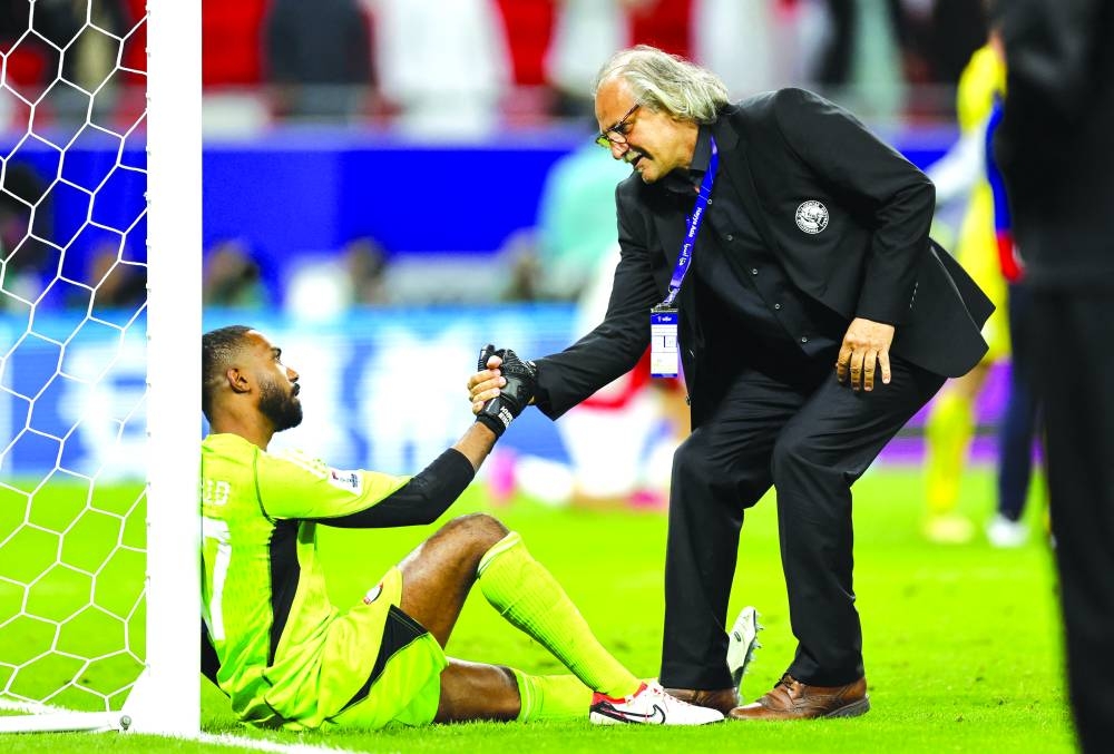 
Tajikistan’s coach Petar Segrt (right) consoles UAE goalkeeper Khalid Eisa after the match. 
