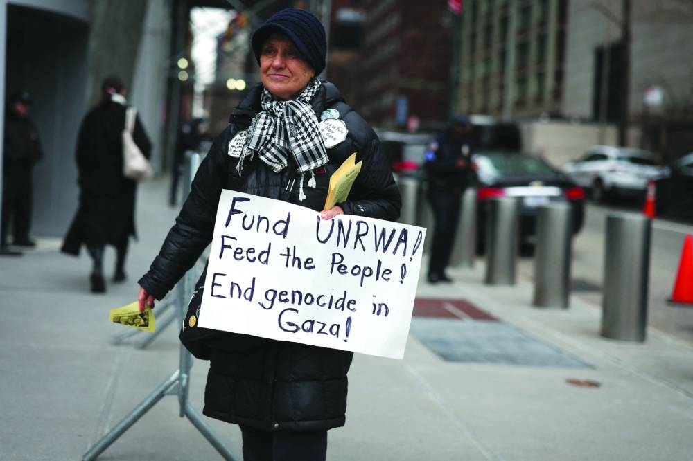 Protesters gather outside the United Nations headquarters in response to the decision by the United States to defund the United Nations Relief and Works Agency for Palestine Refugees (UNRWA) in New York City, on Wednesday.