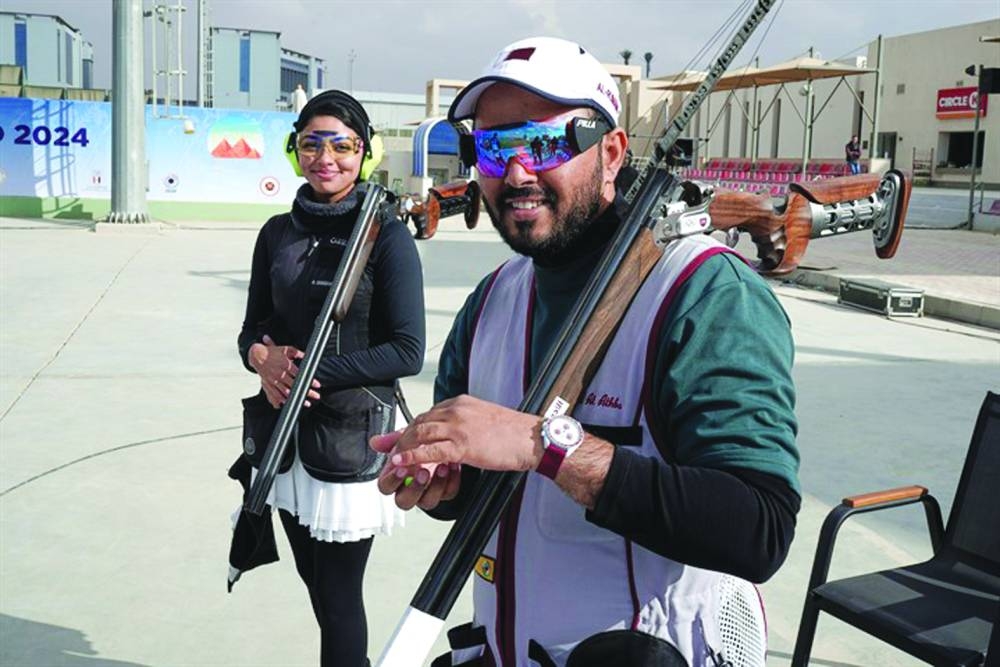 
Qatar’s Rashid Saleh al-Athba (right) and Reem al-Sharshani pose after winning skeet mixed team gold at ISSF World Cup in Cairo. 