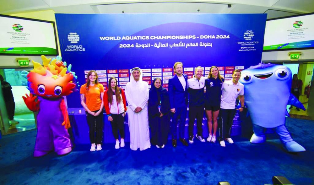 Khaleel al-Jaber, General Director of the Doha 2024 Organising Committee and President of the Qatar Swimming Association, Brent Nowicki, World Aquatics Executive Director, and Sheikha Asma al-Thani, Doha 2024 Director of Marketing, Communications, Opening & Closing Ceremonies Committee, join athletes during a news conference at Aspire Academy in Doha on Thursday.