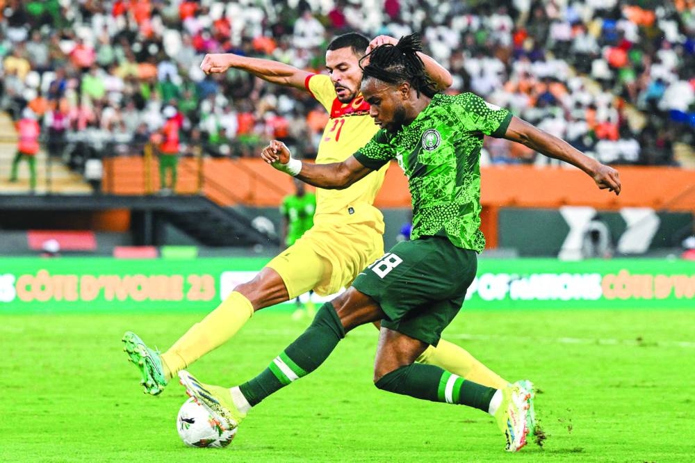 Angola’s Eddie Afonso (left) vies for the ball with Nigeria’s Ademola Lookman during the Africa Cup of Nations quarter-finals in Abidjan, Ivory Coast, on Friday. (AFP)