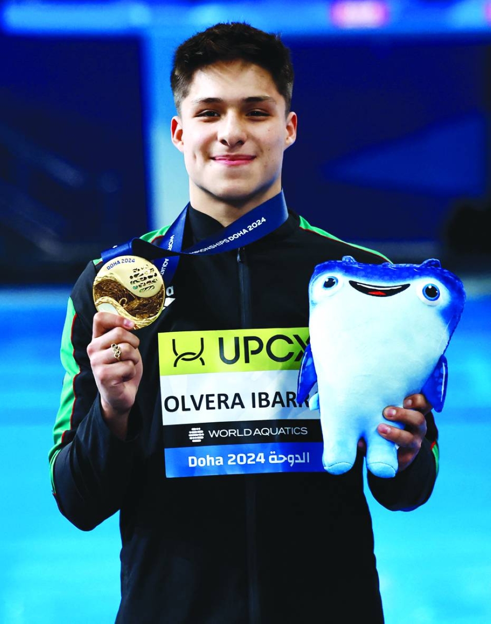 
Gold medallist Osmar Olvera Ibarra of Mexico poses after winning the men’s 1m springboard final at Hamad Aquatic Centre. (Reuters) 