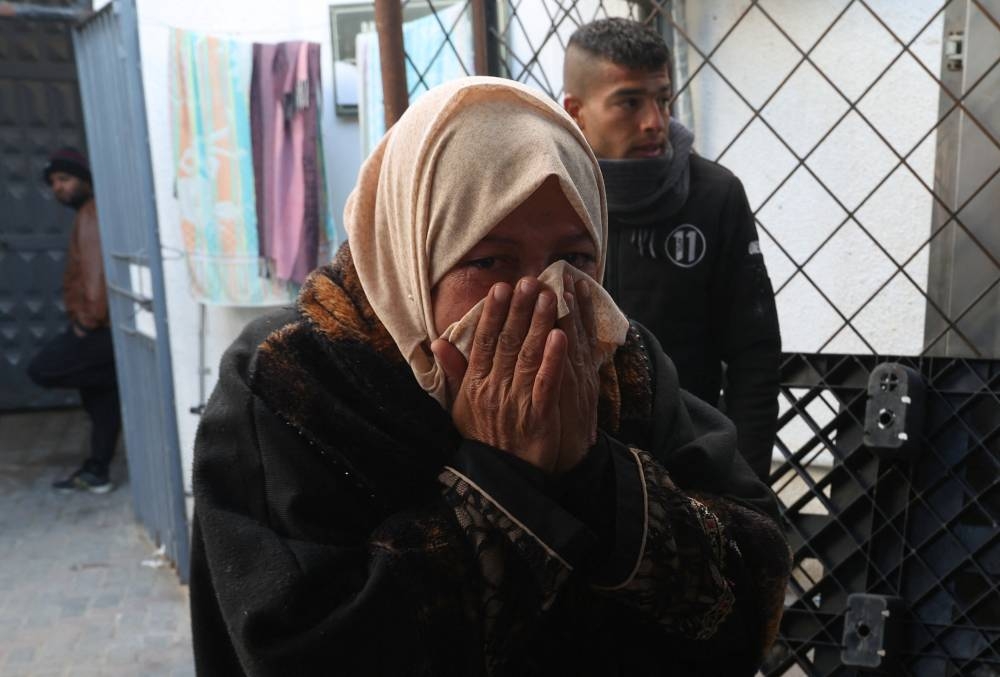 A mourner reacts after two Palestinian children were killed in Israeli strikes in Rafah on Sunday. REUTERS