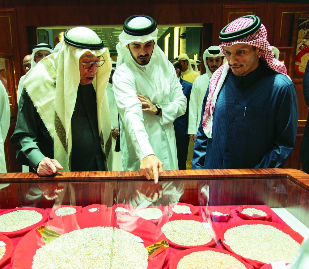 HE the Prime Minister and Minister of Foreign Affairs Sheikh Mohammed bin Abdulrahman bin Jassim al-Thani, HE the Minister of Interior Sheikh Khalifa bin Hamad bin Khalifa al-Thani are seen with prominent Qatari entrepreneur Hussain Alfardan at the Alfardan Jewellery pavilion at DJWE 2024 Monday.