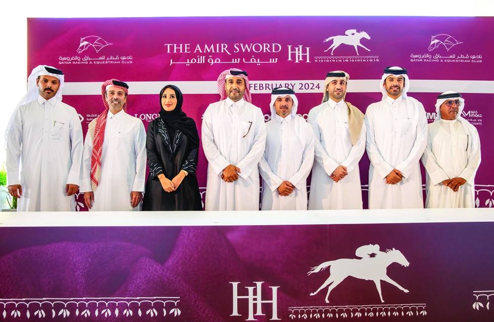Chairman of the Board of Directors of QREC Issa bin Mohamed al-Mohannadi, Acting CEO Bader Mohamed al-Darwish and Racing Manager Abdullah Rashid al-Kubaisi pose with representatives of sponsors for HH The Amir Sword Festival on Tuesday.