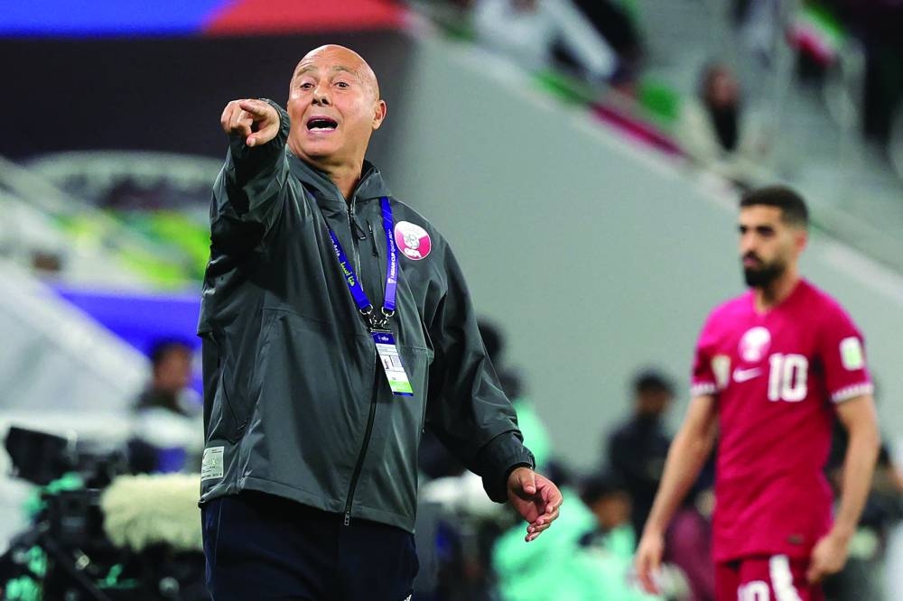 Qatar’s coach Marquez Lopez gestures during the semi-final against Iran at Al Thumama Stadium in Doha on Wednesday. (AFP)