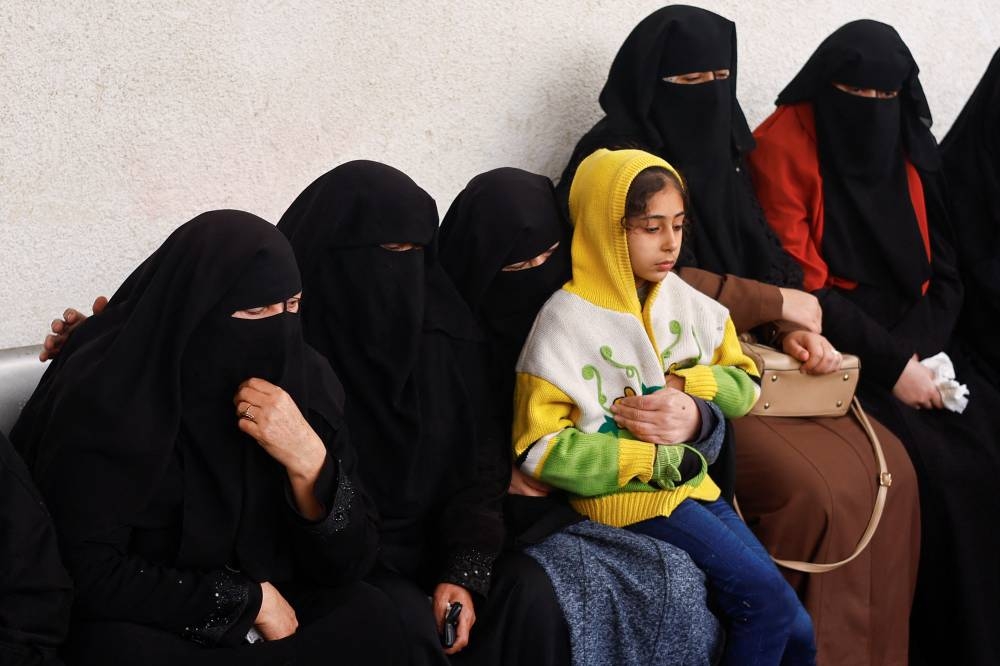Mourners react following the death of Palestinians in Israeli strikes at Abu Yousef al-Najjar hospital in Rafah on Friday. REUTERS