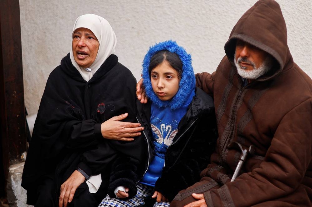 Mourners react following the death of Palestinians in Israeli strikes at Abu Yousef al-Najjar hospital in Rafah on Friday. REUTERS
